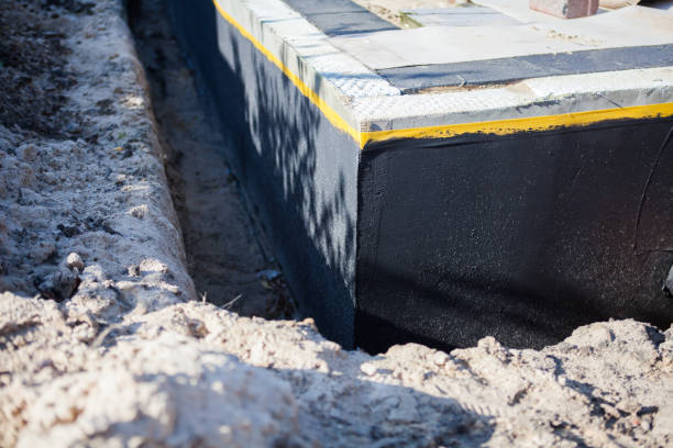 Professional Waterproofing technician working in New Baltimore, VA